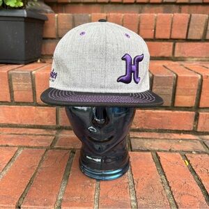 Hoosier Racing Tire flat bill hat with purple embroidery.